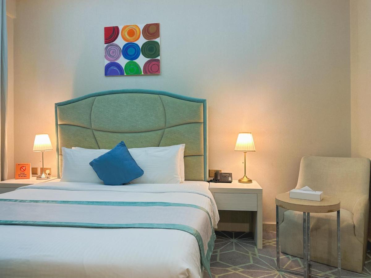 The Victory Hotel Doha Bagian luar foto
